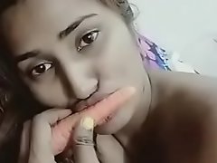 Cute Sexy Indian girl is playing with carrot