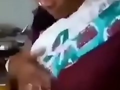 Indian Aunty is showing her boobs to nephew. Nephew is capturing clean out and xxx  kissing her.