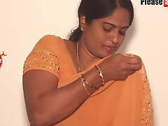 Mother enervating a yellow saree, video