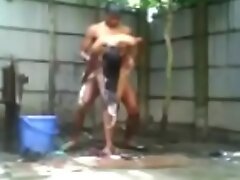 Indian Girl Bathing outside nude and faking a street boy