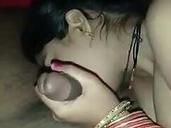Indian wife getting ready her husband