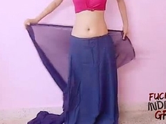young indian wife teaching in any event to wear saree